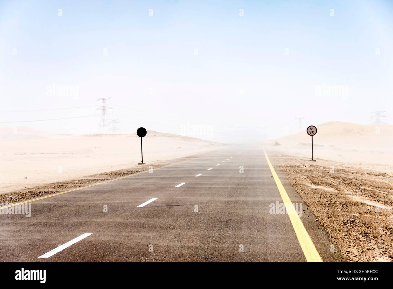 A sandstorm blows across the highway outside of Abu Dhabi City, UAE; Abu Dhabi, United Arab Emirates Stock Photo