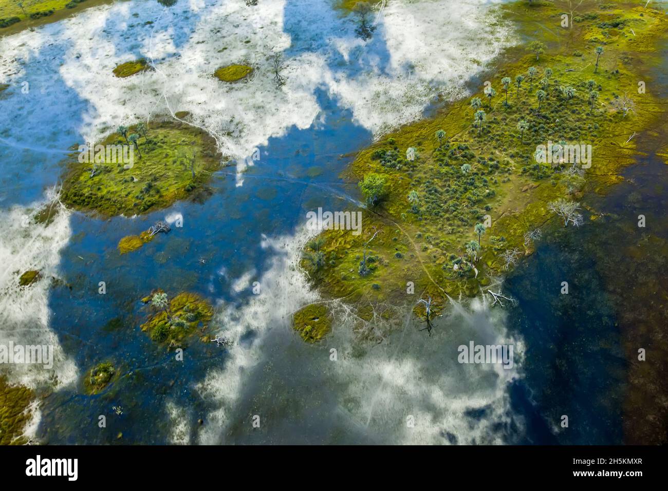 Aerial view of clouds reflected in water of the Okavango Delta. Stock Photo