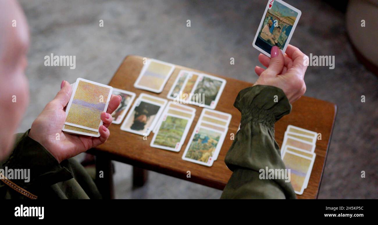 A woman is using tarot cards Stock Photo