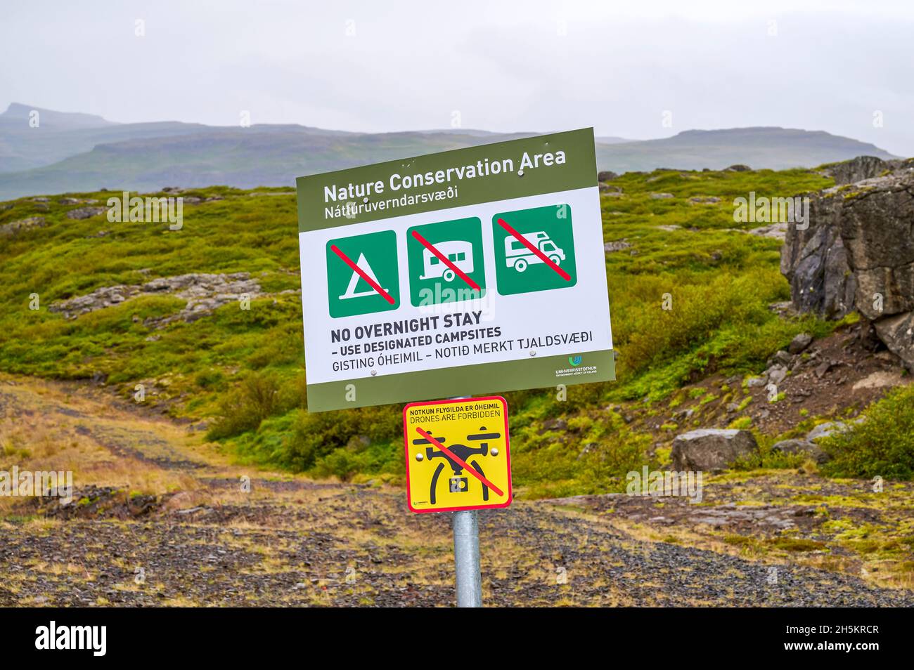 Nature Conservation Area sign prohibiting camping and drone flights; Iceland Stock Photo
