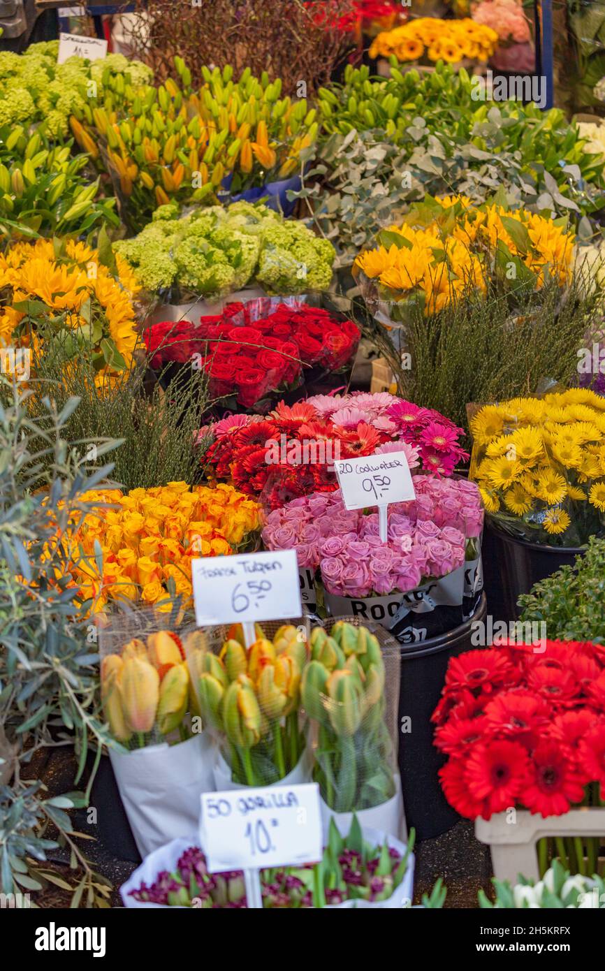 Colourful cut flower bouquets on display for sale at a flower market ...