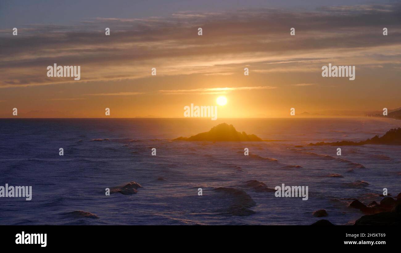 Big waves on a ocean durint the sunset Stock Photo