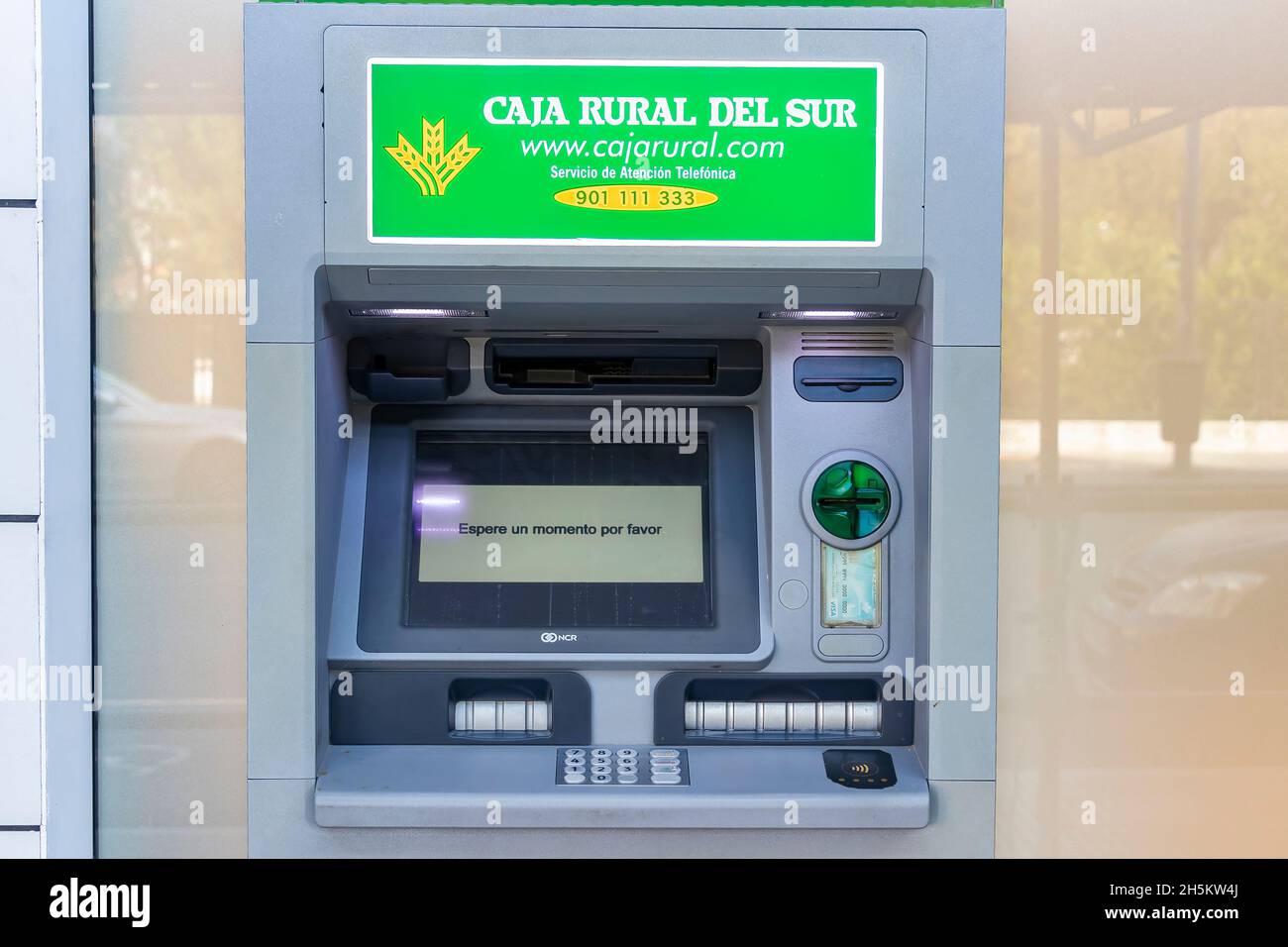 Huelva, Spain - November 10, 2021: ATM machine of Caja Rural bank Stock Photo