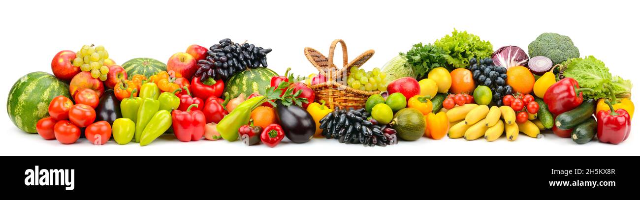 Wide panoramic composition of ripe, juicy fruits, berries and vegetables isolated on white background. Stock Photo