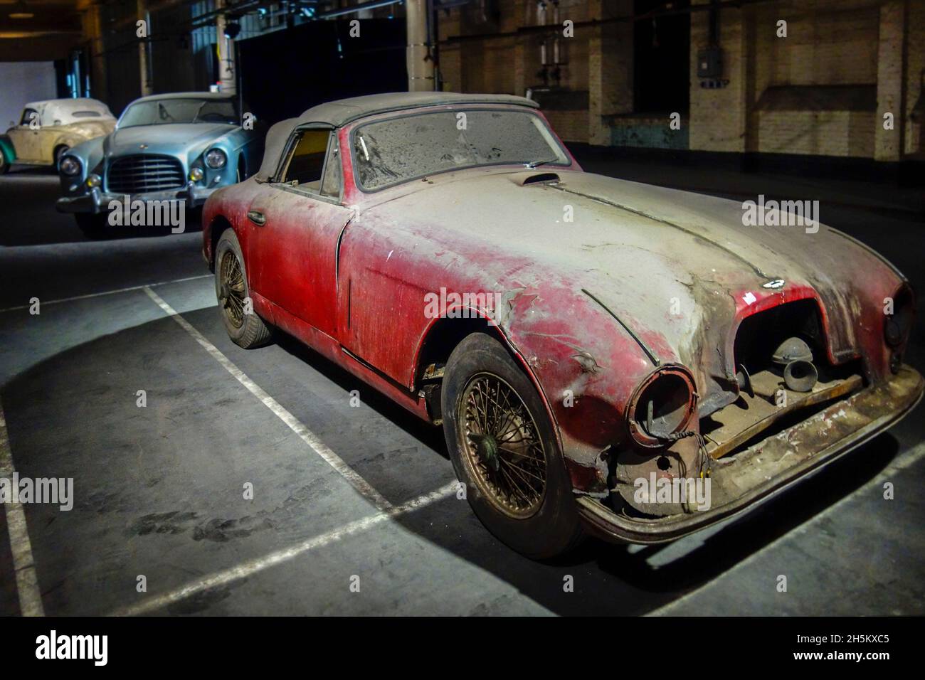 Rusty and dusty 1953 Aston Martin DB2, 2-seat drophead coupé, British classic sports car / oldtimer, in bad shape ready to be restored in garage Stock Photo