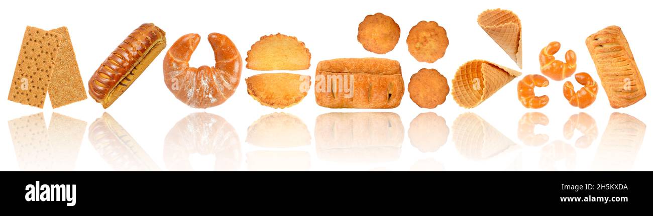 Sweet and fresh baked goods in row with soft reflection isolated on white background. Stock Photo
