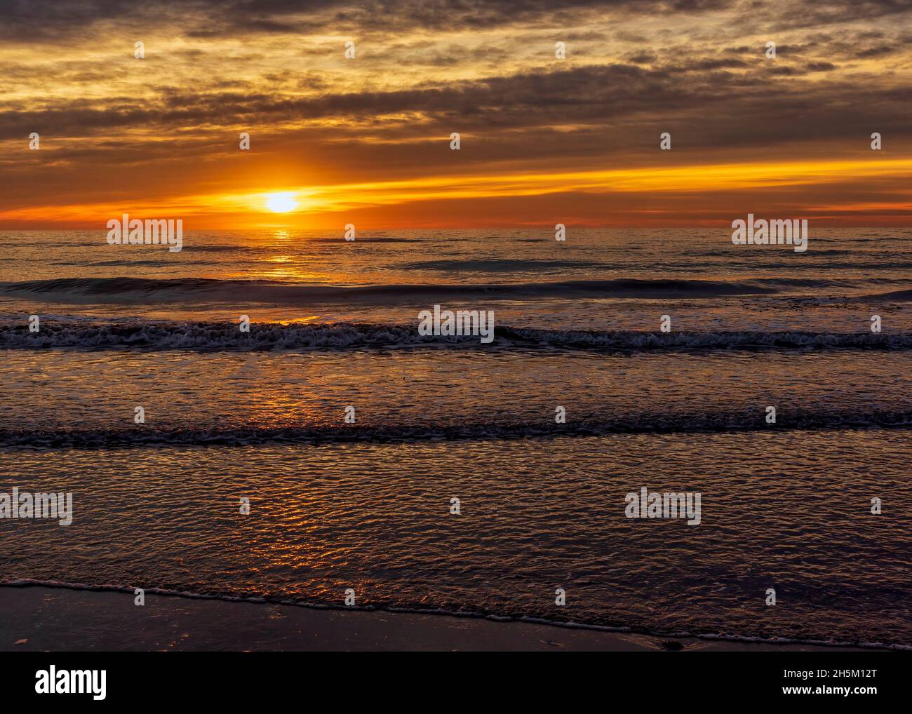 A peaceful sunrise on the beach of the Costa Azahar, Spain Stock Photo