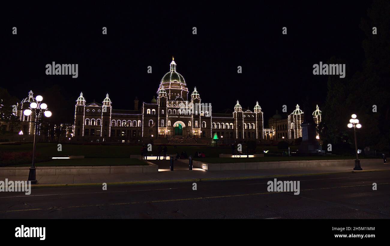 Beautiful night view of illuminated British Columbia Parliament Building in Victoria downtown, Canada on Vancouver Island with street lights. Stock Photo