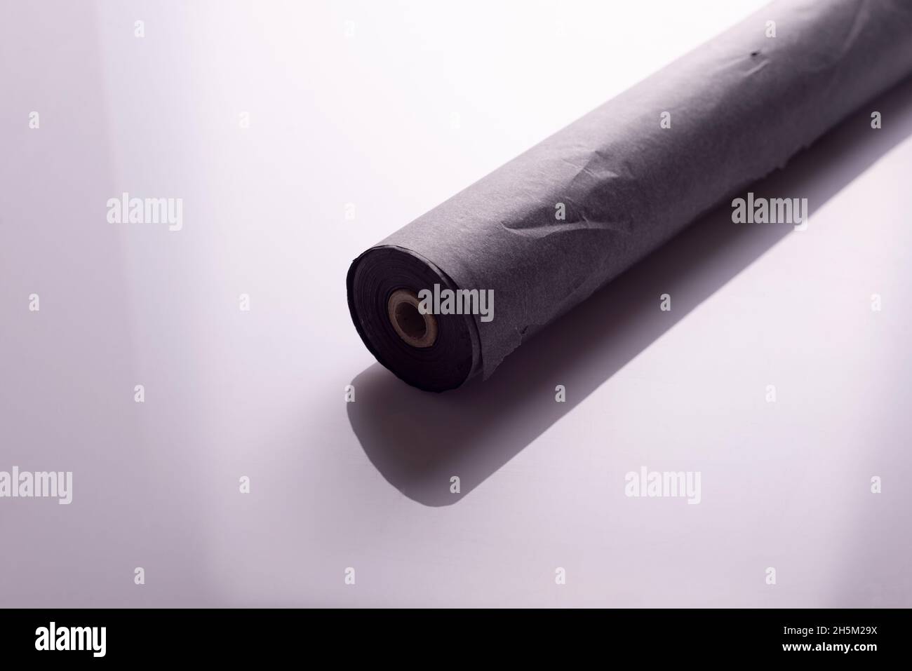 roll of black carbon paper tape on white background Stock Photo Alamy