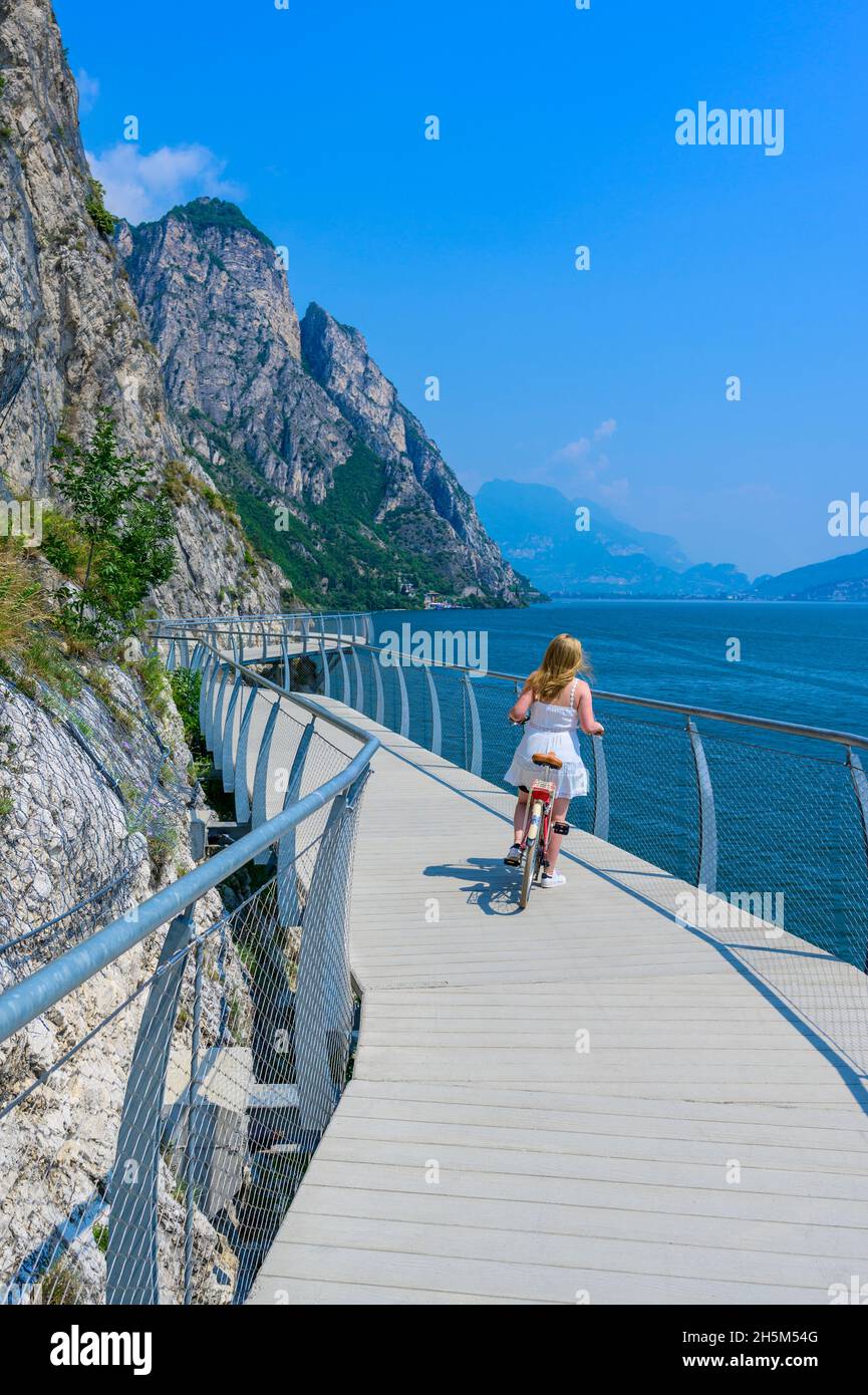 Ciclopista del Garda" - Bicycle road and foot path over Garda lake with  beautiful landscape scenery at Limone Sul Garda - travel destination in  Bresc Stock Photo - Alamy