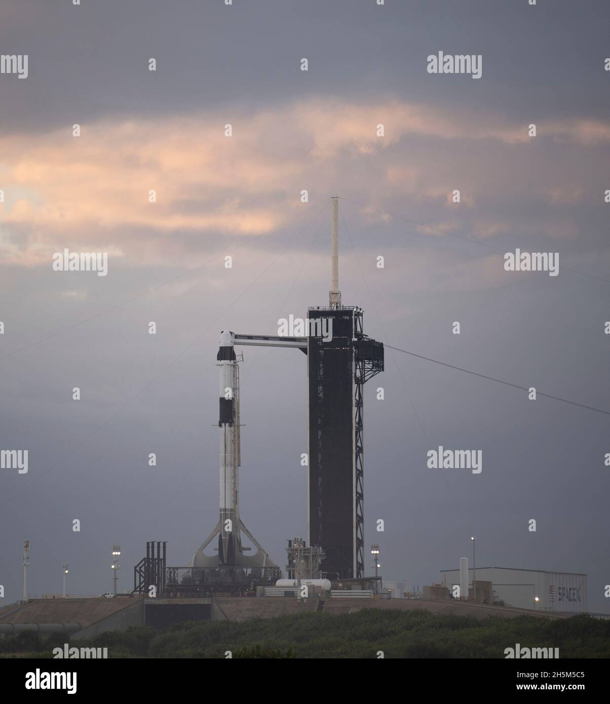 Cape Canaveral, United States of America. 10 November, 2021. A SpaceX Falcon 9 rocket with the Crew Dragon spacecraft for the NASA SpaceX Crew-3 mission to the International Space Station continues preparations on Launch Complex 39A at the Kennedy Space Center early morning November 10, 2021 in Cape Canaveral, Florida. The crew of NASA astronauts Raja Chari, Tom Marshburn, Kayla Barron, and European Space Agency astronaut Matthias Maurer are expected to launch later in the day after several delays. Credit: Joel Kowsky/NASA/Alamy Live News Stock Photo