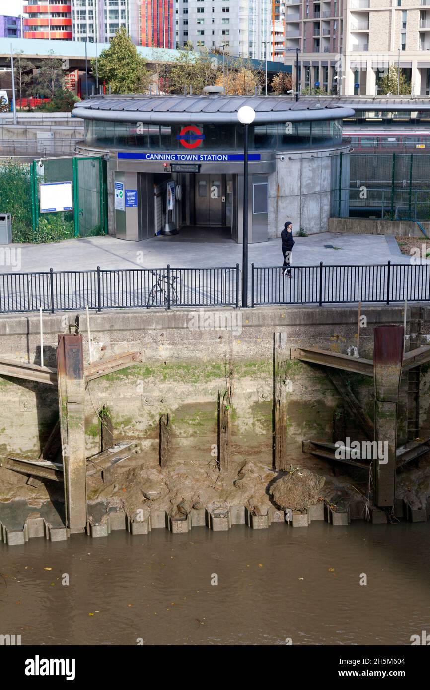 Tube station entrance alongside Bow Creek, Canning Town, London Stock Photo