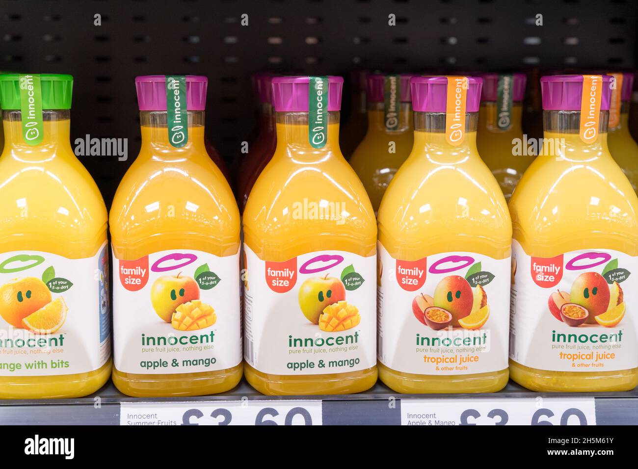 Bottles fruit juice in supermarket hires stock photography and images