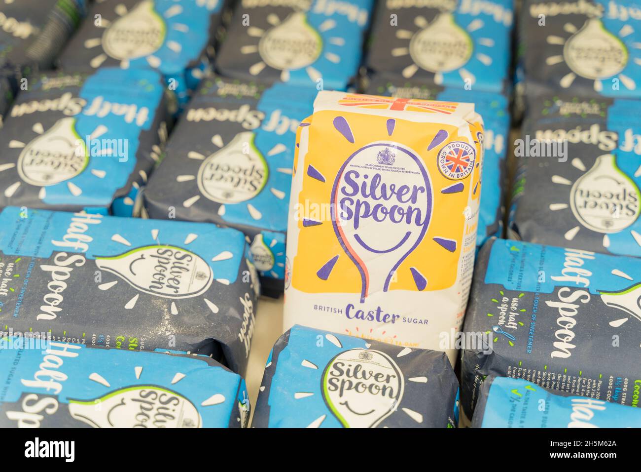 plenty packages of Silver spoon caster sugar in paper package readily