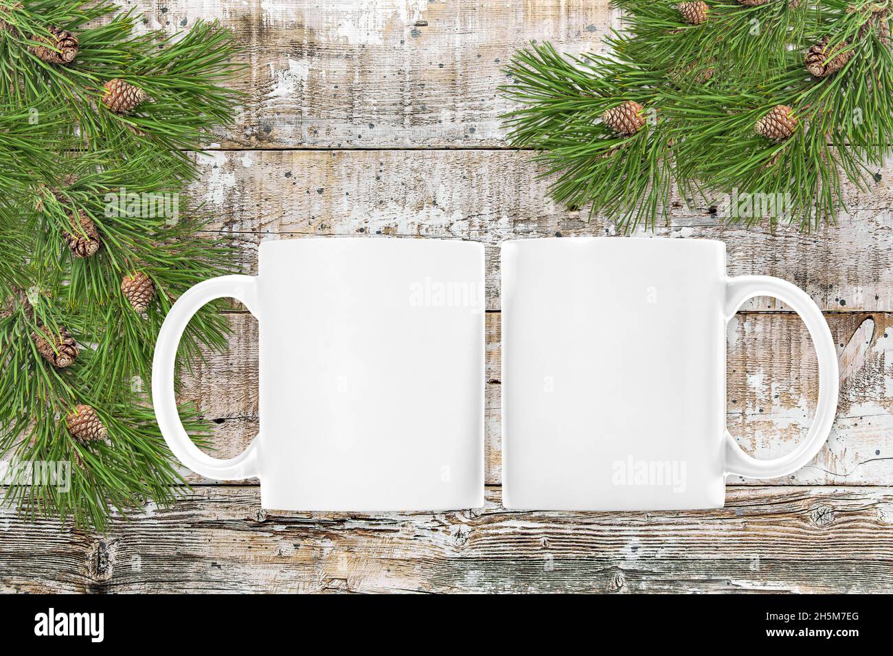 White mug mock up with Christmas tree decoration Stock Photo