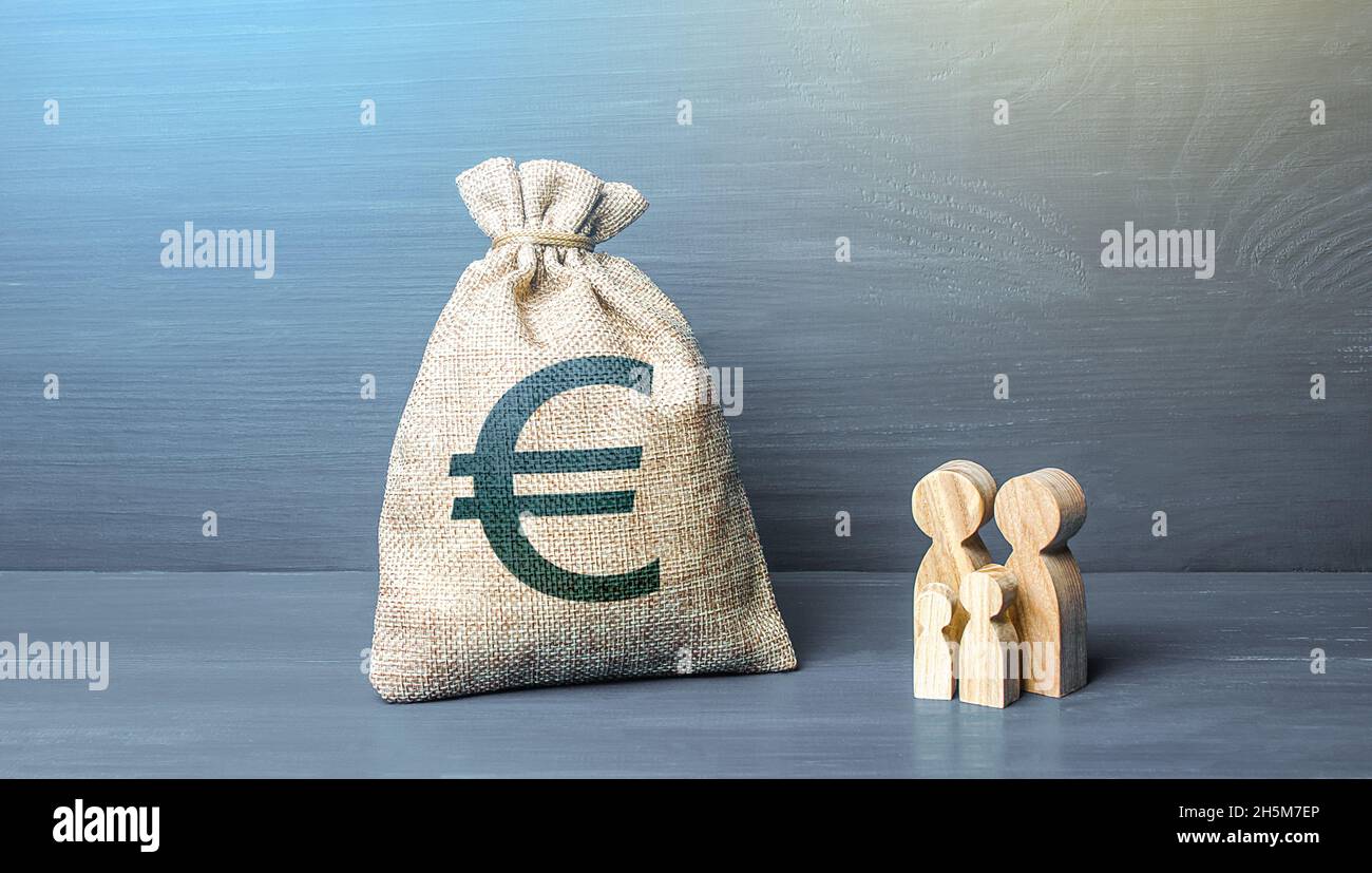 Family figurines and euro money bag. Social policy, family budget. Investment in human capital. Income, expenses. Favorable conditions for population Stock Photo