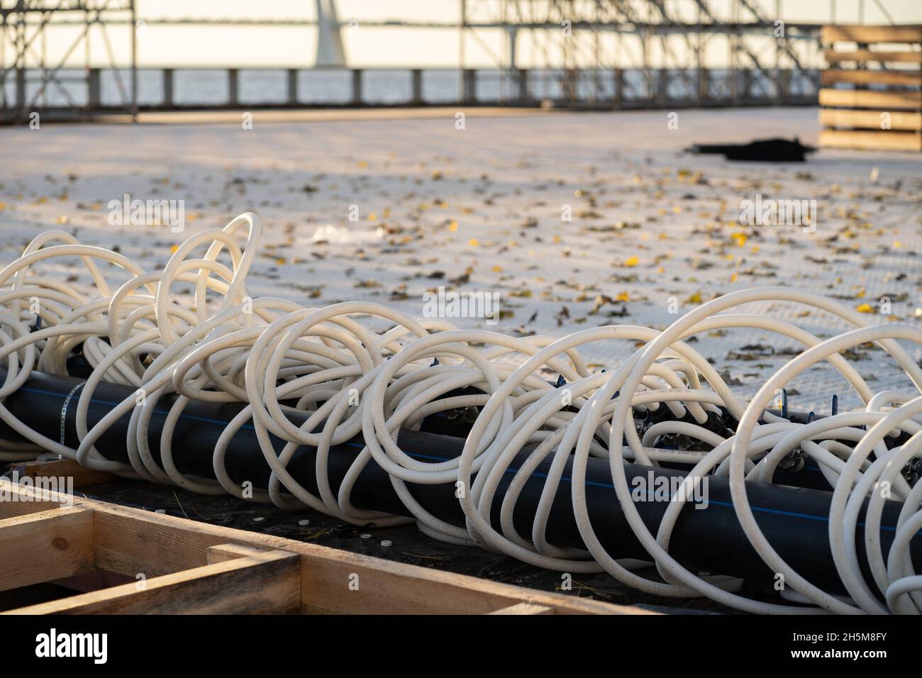 Building of portable ice rink skating rink piping system with industrial tubing for low