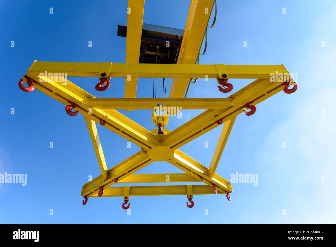 Special crane for lifting boats in the marina seen from below against
