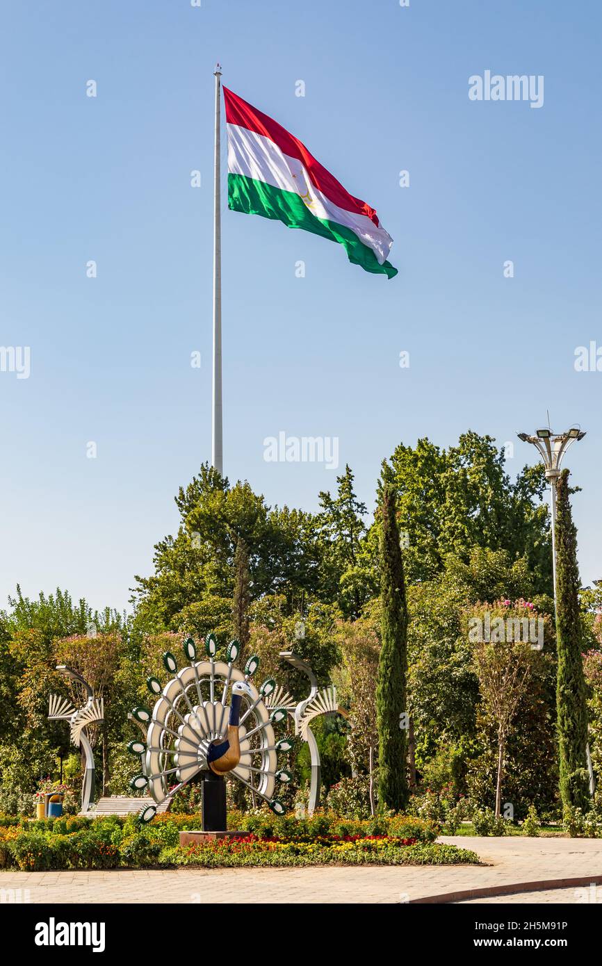 Dushanbe, Tajikistan. August 11, 2021. Tajik flag flying in Rudaki Park. Stock Photo