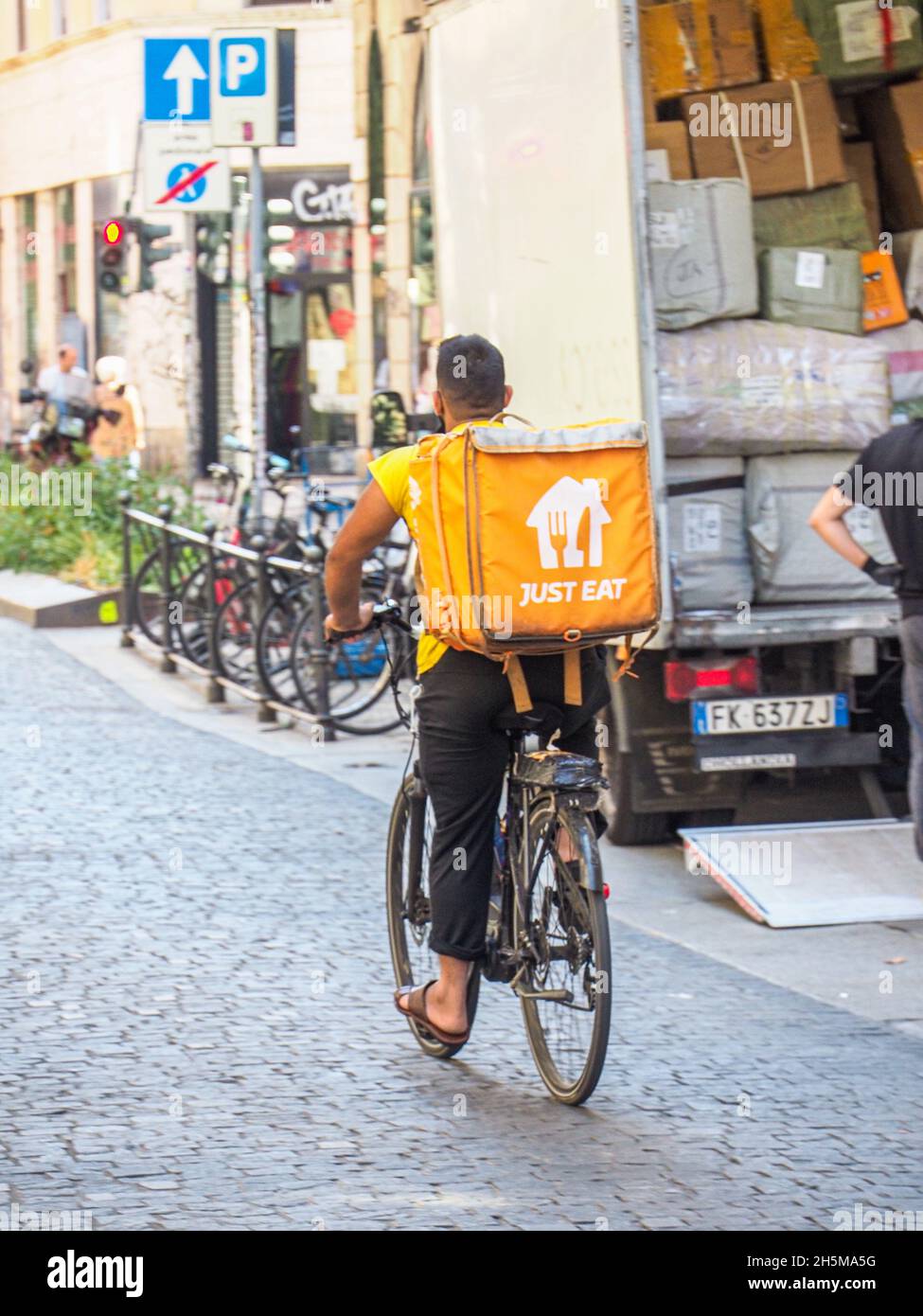 App delivery riders and transporter in the center of Milan Italy Stock ...