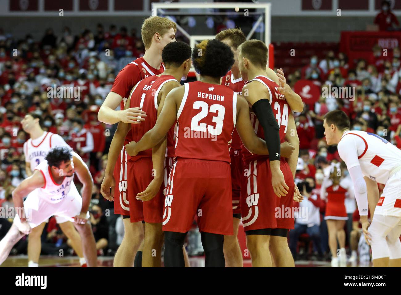 November 09, 2021: Wisconsin Badgers guard Brad Davison (34), forward Steven Crowl (22), guard Chucky Hepburn (23), guard Jonathan Davis (1), and forward Tyler Wahl (5) huddle before the opening tip during the NCAA Basketball game between the St. Francis Terriers and the Wisconsin Badgers at the Kohl Center in Madison, WI. Darren Lee/CSM Stock Photo