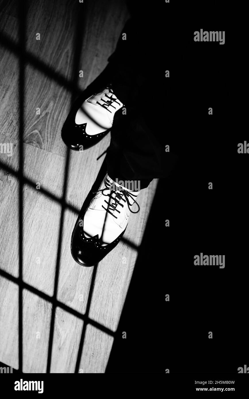 Male dancer teacher dancing in nightclub ballroom in jazz dance shoes. Stock Photo