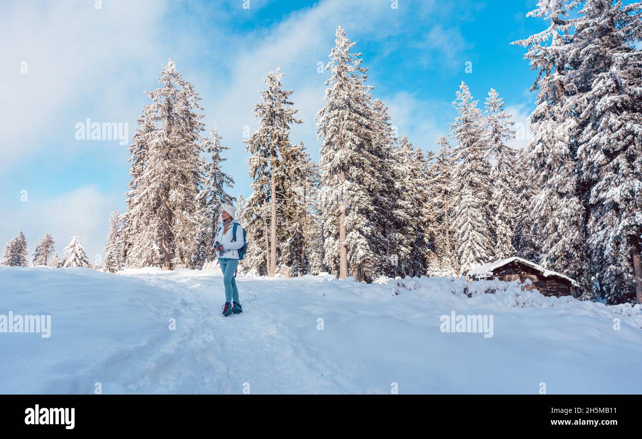 Hiking in the snow on a mountain slope in winter Stock Photo