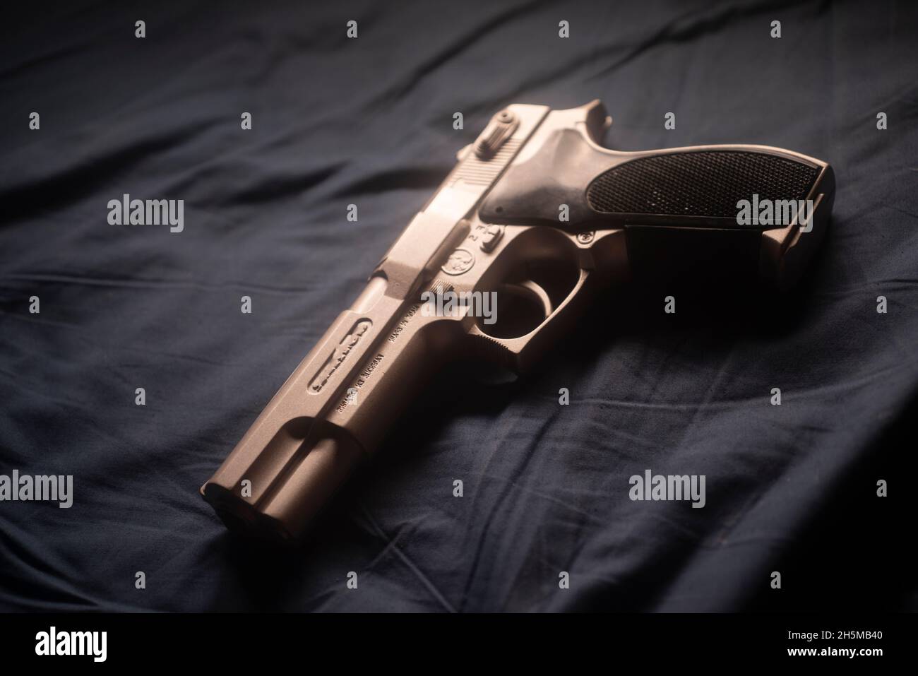 9mm pistol on bed