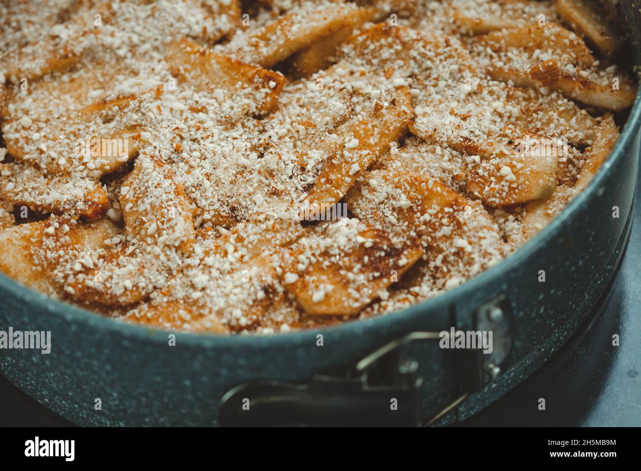 Close-up of raw apple pie in baking dish Stock Photo