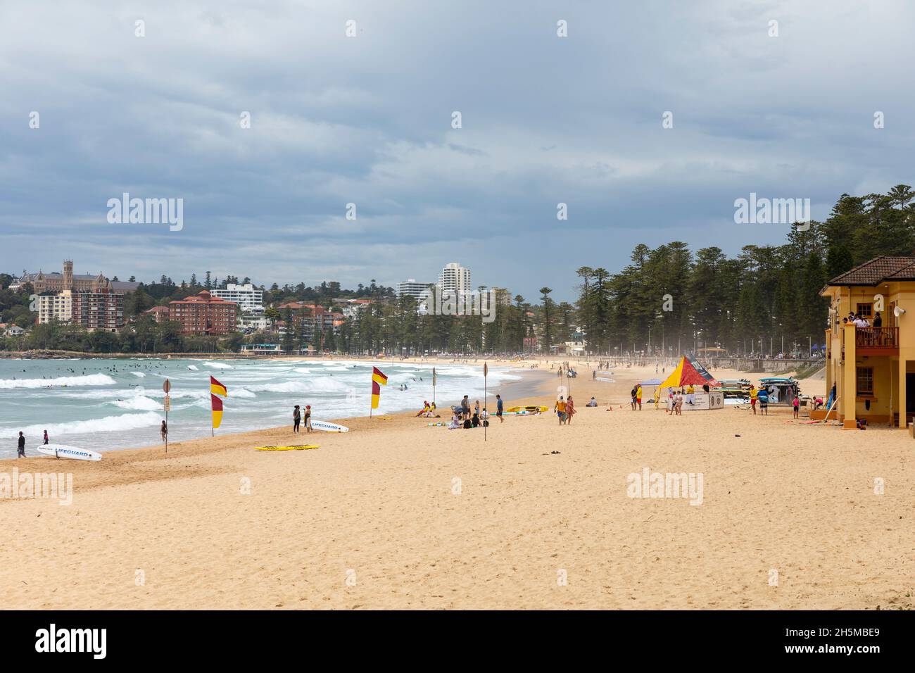 Manly Beach in Sydney, red and yellow surf rescue flags and lifeguards,Sydney,NSW,Australia Stock Photo