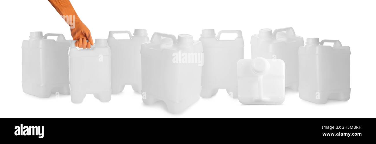 Hand with plastic jerrycans on white background Stock Photo