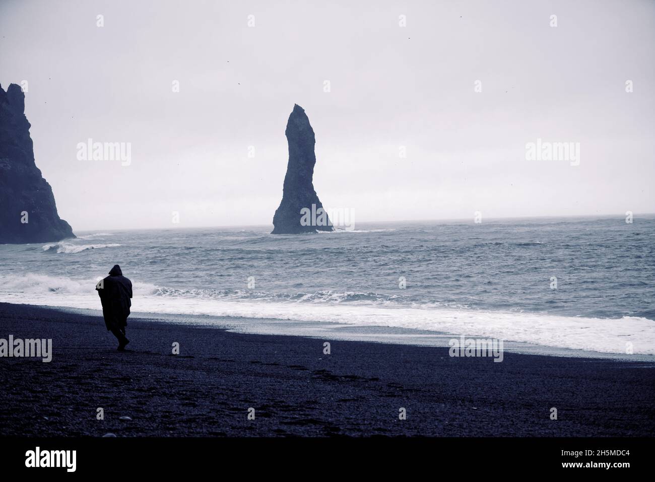 The Reynisdrangar basalt sea stacks and the Reynisfjara black sand ...