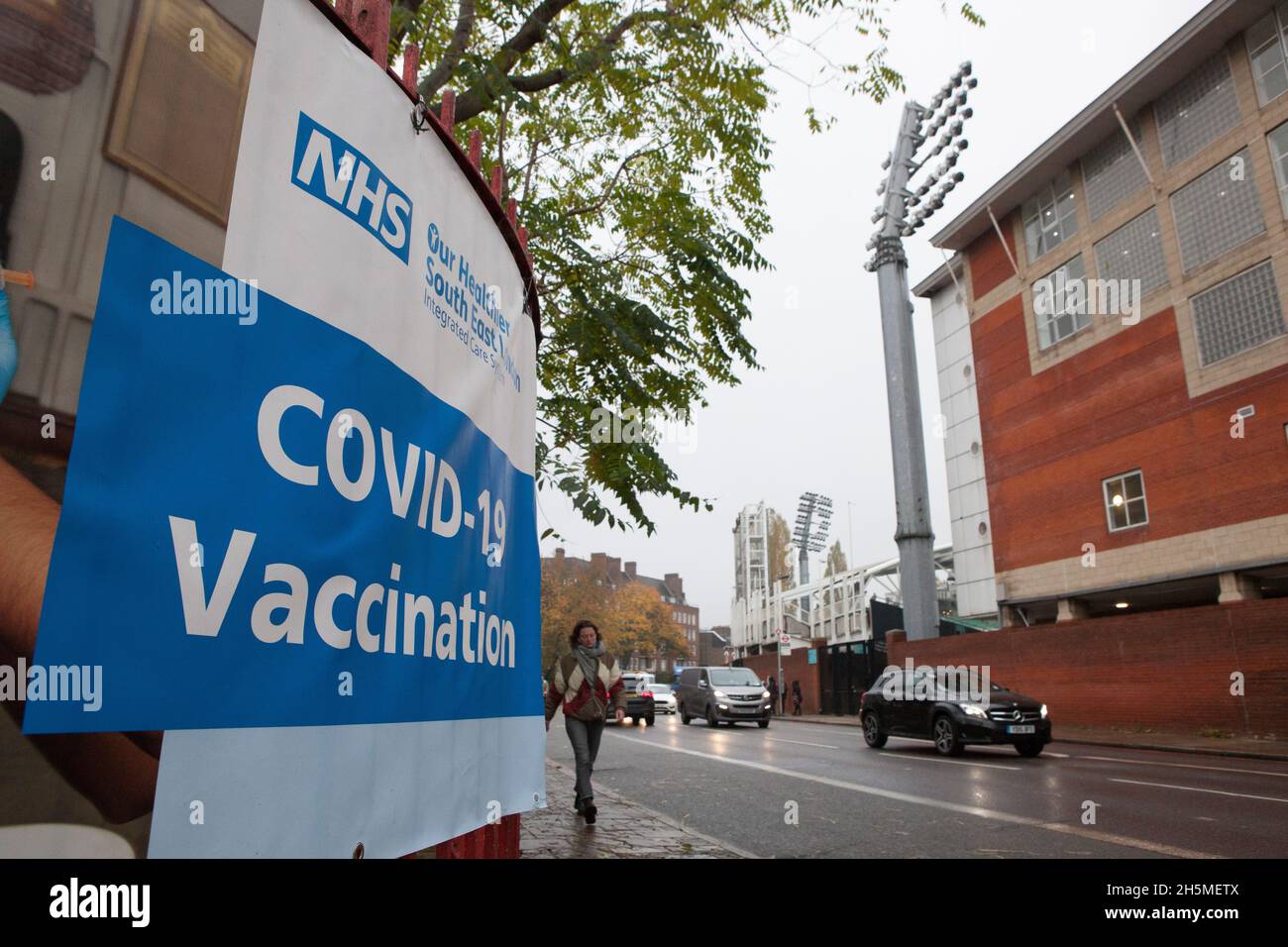 London, UK, 10 November 2021: at a vaccination centre next to Kennington Oval cricket ground a steady stream of people attend to get their booster jabs or first jabs of Pfizer coronavirus vaccine. Anna Watson/Alamy Live News Stock Photo