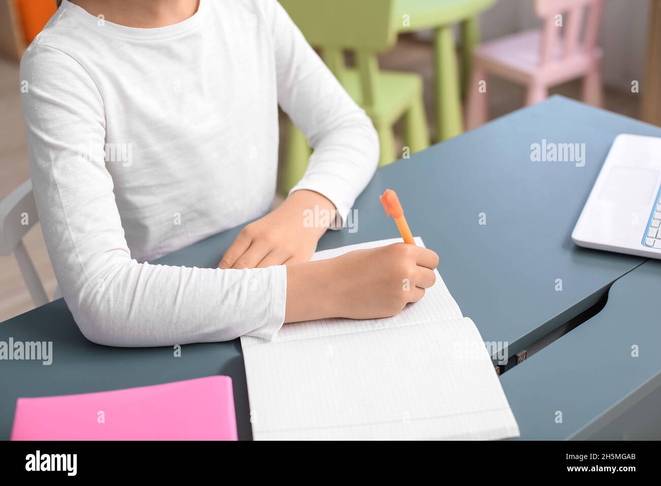 Little girl studying at home Stock Photo