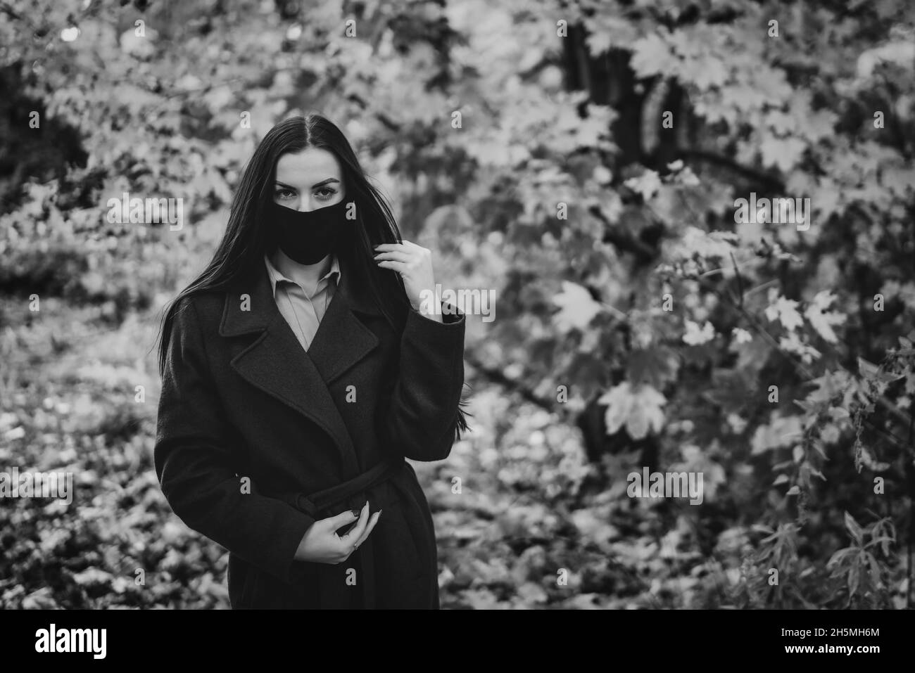 Portrait of a young woman in the park in black and white Stock Photo ...