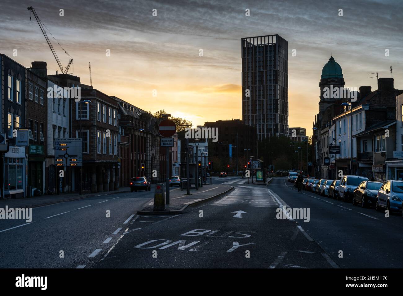 The sun sets behind Castle Park View and Old Market in Bristol, England. Stock Photo
