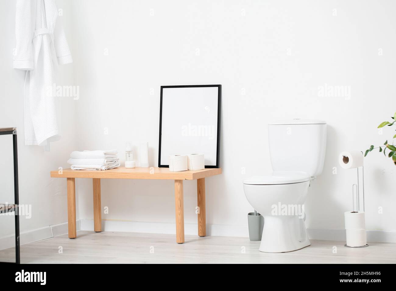Interior of modern restroom with toilet bowl Stock Photo - Alamy