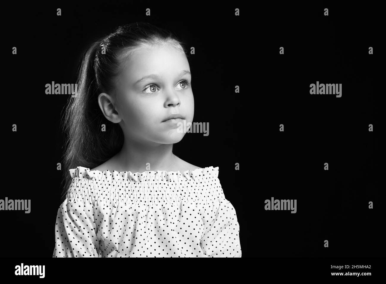 Black and white portrait of pretty little girl on dark background Stock ...
