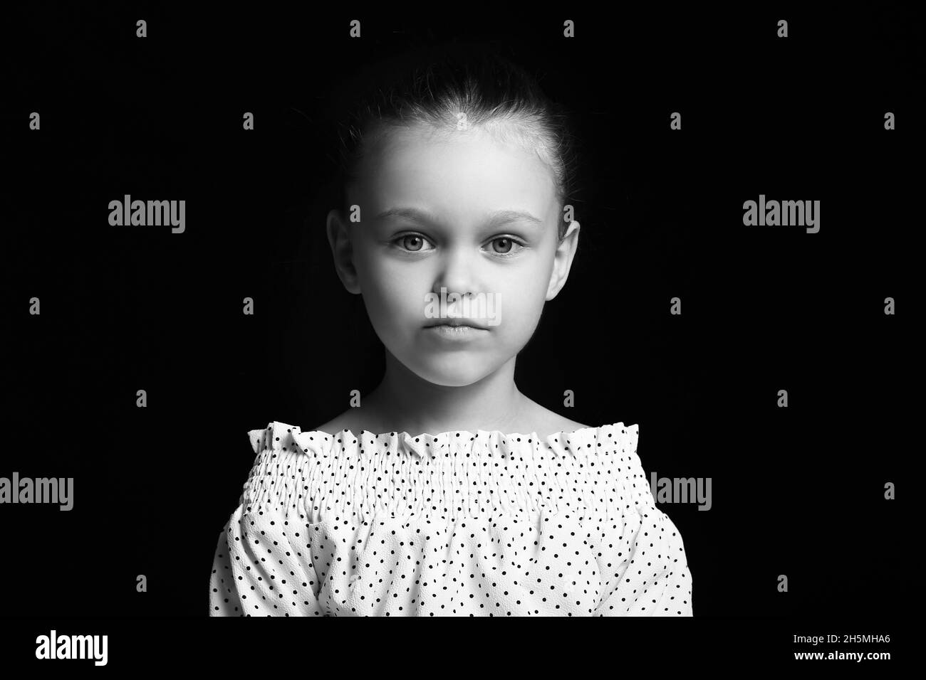 Black and white portrait of pretty little girl on dark background Stock ...