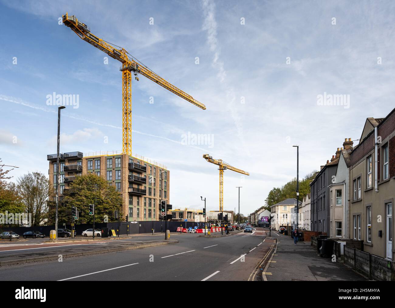 Tower cranes rise over the construction site for apartment buildings at ...