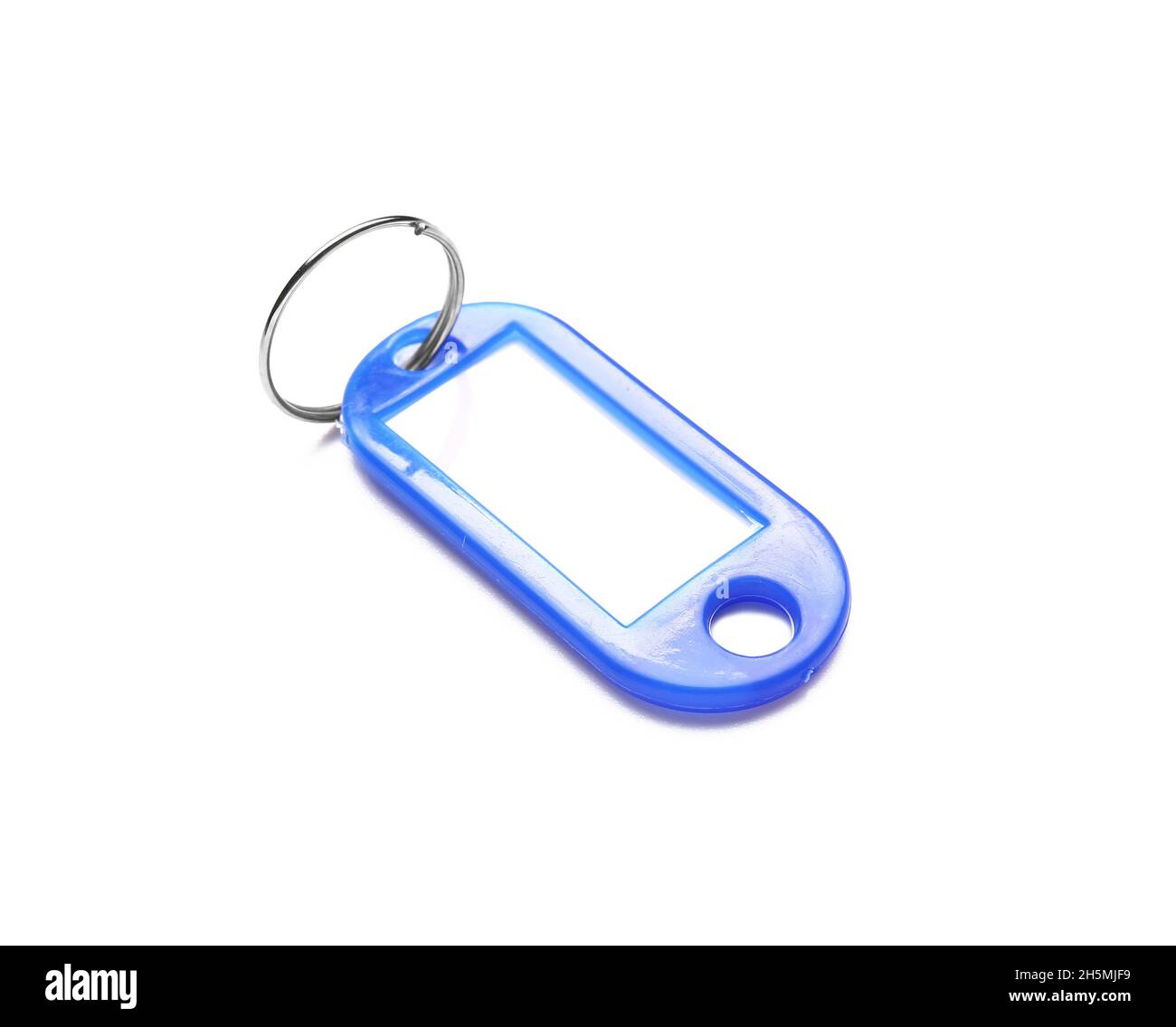 Plastic key tag on white background Stock Photo - Alamy