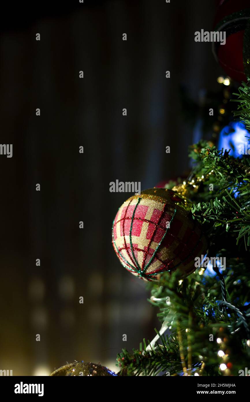Close-up shot of a red ball hanging on the Christmas tree Stock Photo ...