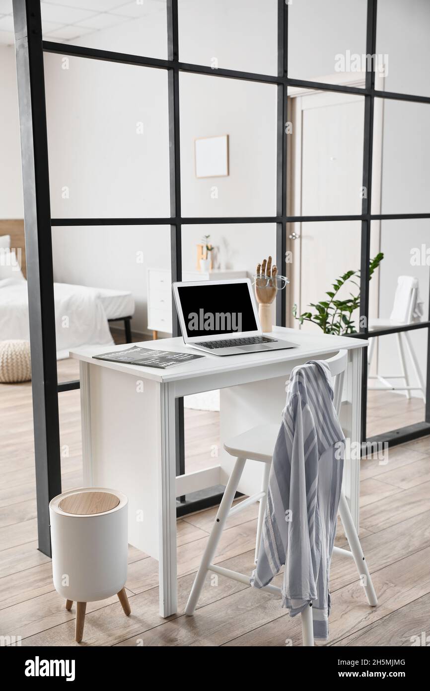 Modern workplace in studio apartment Stock Photo Alamy