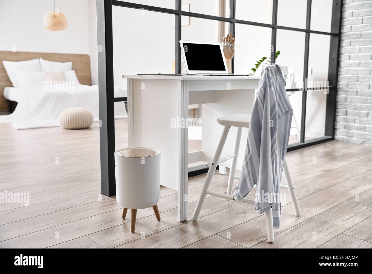 Modern workplace in studio apartment Stock Photo Alamy