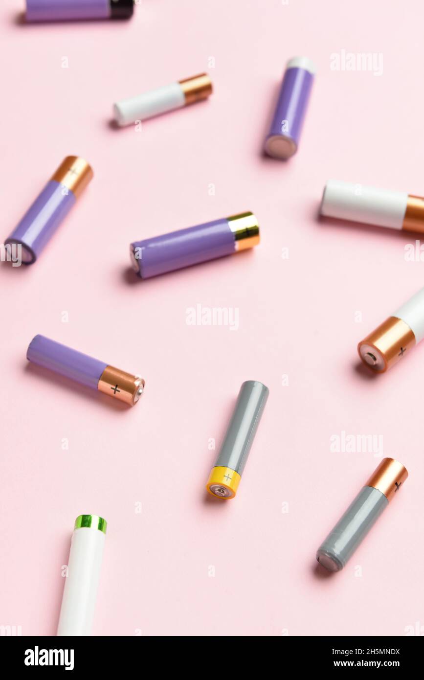 Alkaline batteries on pink background Stock Photo