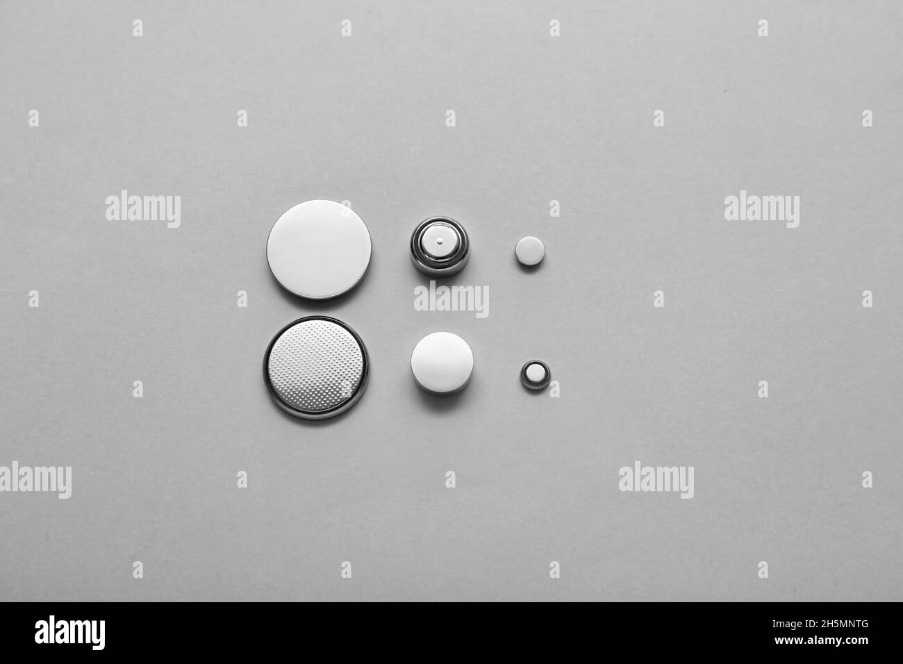 Lithium button cell batteries on light background Stock Photo Alamy