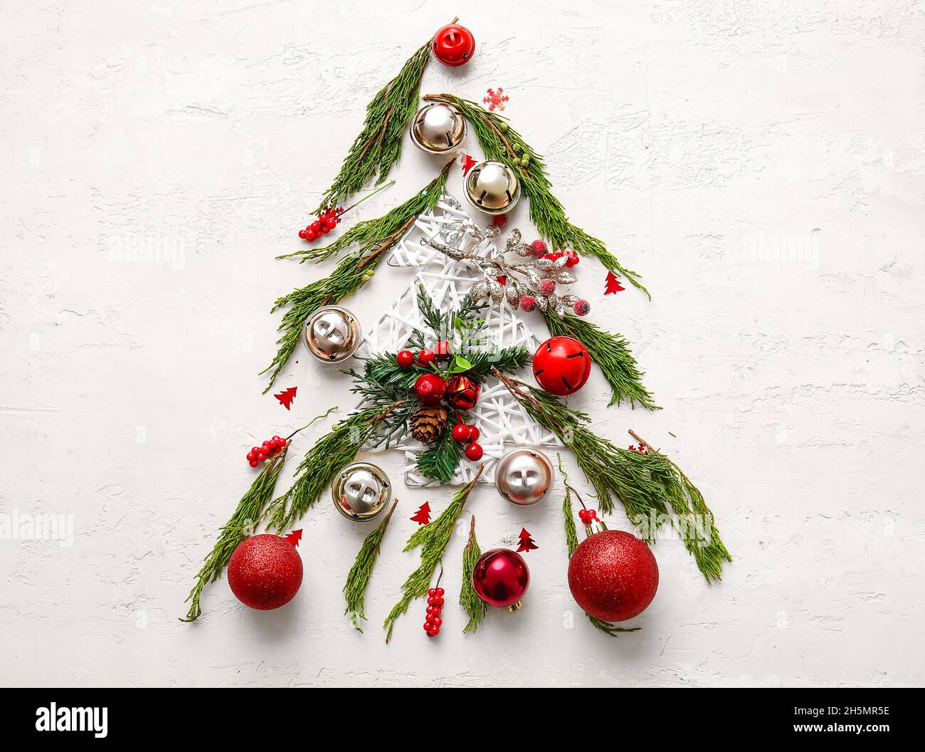 Tree made of coniferous branches and Christmas decor on white ...