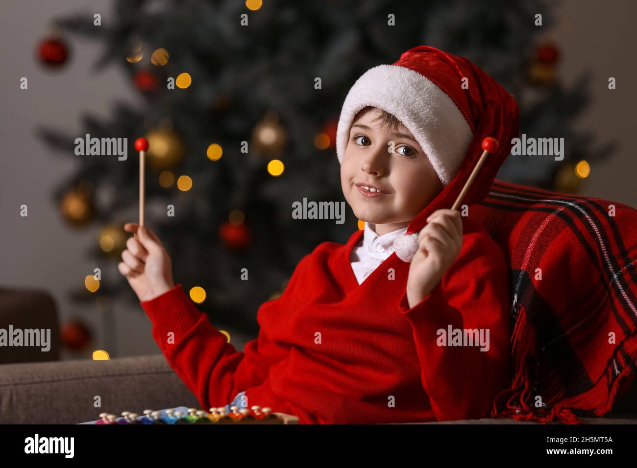 Little boy playing xylophone at home on Christmas eve Stock Photo Alamy