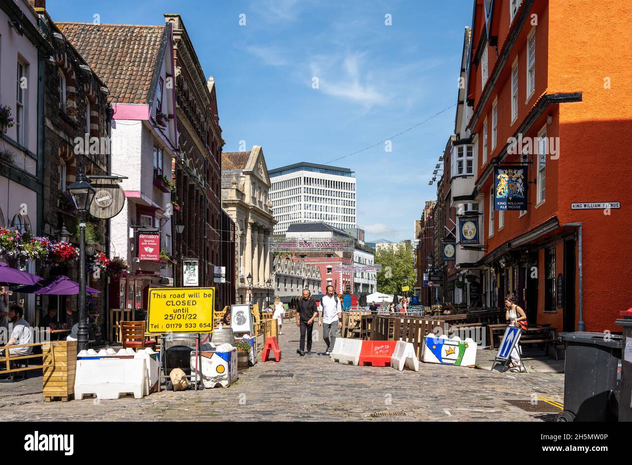 Outdoor tables fill a street if bars and restaurants that is closed to motor traffic during the Covid-19 pandemic in Bristol, England. Stock Photo