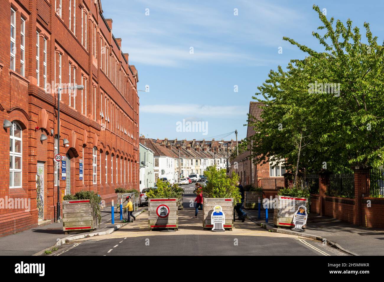 A street outside a primary school is closed to motor traffic using flower planters to create a 'modal filter' in Southville, Bristol. Stock Photo